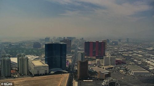Fire near Las Vegas blankets iconic Strip in smoke as tourists continue to shun 'dying' city