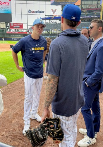 On the fast track? First-rounder Andrew Fischer signs, swings with the Brewers