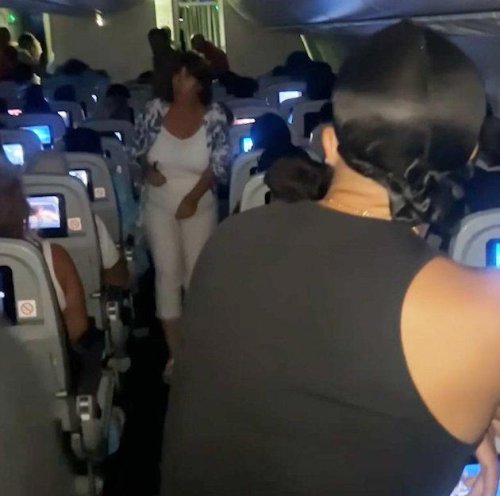 Hero passengers stop man opening plane door mid flight
