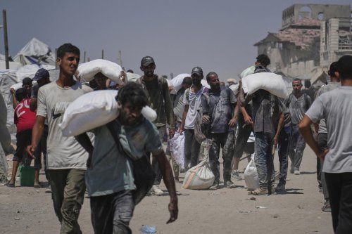 Israeli strikes kill at least 36 people in Gaza, officials say, as some aid restrictions are eased