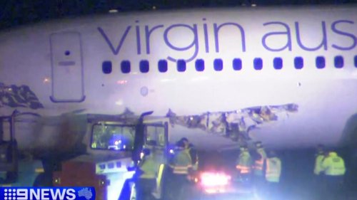 Plane ripped in collision at major airport