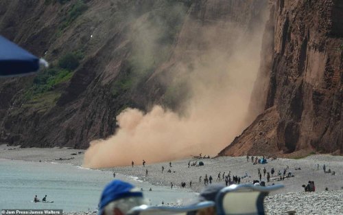 Rockfall crashes onto Devon beach, nearly hitting sunbathers