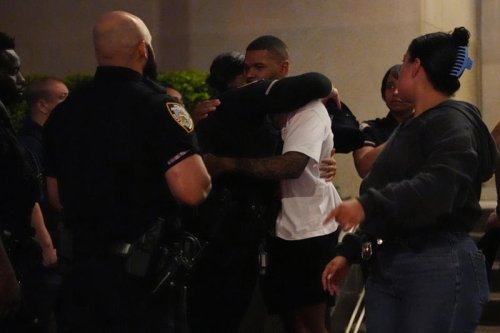Four killed, including NYPD officer, after gunman entered Midtown Manhattan office building