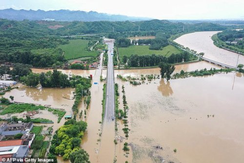 Dozens killed and tens of thousands evacuated as China hit by 'once in century' flooding