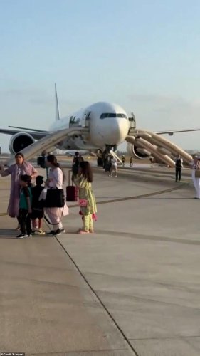 Passengers flee jet after it bursts into flames