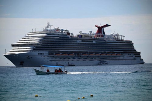 Carnival cruise ship tilts amid rough weather, scattering dishes, flooding elevator