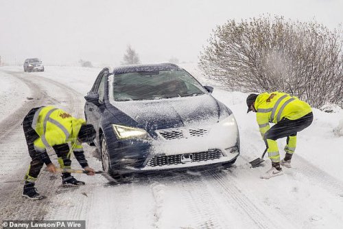 Travel chaos in blizzard Britain: Roads close and schools shut with new ice warnings to hit in hours