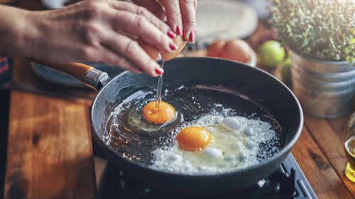 Use a hot, lubricated pan to prevent sticking, For lacy, crispy edges, baste the eggs' edges with hot oil, Add water for fried eggs with tender, uncolored whites, Add buttery, toasty richness by frying eggs in cream, Here's how to get firm whites while keeping the yolk runny, Use room temperature eggs to ensure even frying, Add a splash of vinegar for a simple twist, To add extra crunch and flavor, fry eggs on shredded Parmesan, Cooking for a crowd? Fry your eggs in the oven, Fried egg hacks you'll wish you knew sooner