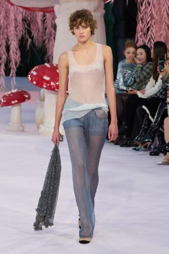 I can't stop thinking about Chanel's couture version of a white tank and jeans
