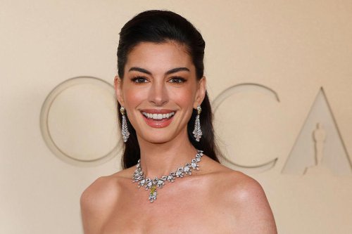 Anne Hathaway brings spring to the Oscars in a striking floral gown