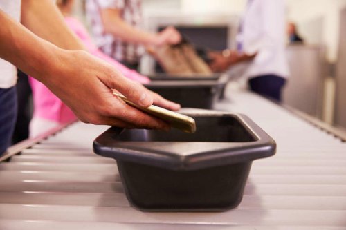 This is why you should never put your phone in the TSA bin, according to frequent flyers and travel experts