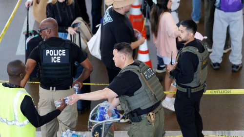 ICE agents take a more active role in airport security, but long lines persist ahead of the weekend traveler rush
