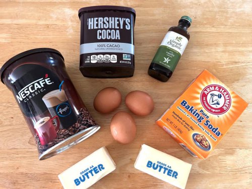 Garten's chocolate cake features cocoa powder, espresso powder, and "good" vanilla., You'll also need some ingredients for the mocha frosting., I also prepped my dry ingredients ..., &hellip; and my chocolate-and-coffee mixture., It was time to start the batter., Garten says to beat the butter and sugar for around four to five minutes on medium speed., Then I added the vanilla and eggs., I turned my mixer to low and started adding my flour and chocolate mixtures., My cake batter was ready!, I poured my chocolate batter into the prepared pan and smoothed the top., I placed my cake in the oven, which had been preheated to 350 degrees Fahrenheit., Once my cake was out of the oven, I let it cool completely in the pan., While my cake was cooling, I began making the frosting., Then I placed the chocolate in a bowl with the butter and espresso powder., I also prepped the cream., Once the cream was ready, I poured it over the chocolate mixture., Then I stirred in the Kahl&uacute;a and vanilla., I covered my frosting and refrigerated it for 30 minutes., Once it had chilled, I scraped down the bowl and beat the frosting with a handheld mixer., It was time to frost my cake., I cut my cake into squares just as Garten had, and voil&agrave; &mdash; it was ready to eat!, Garten's chocolate cake with mocha icing tasted rich and decadent., I made Ina Garten's easy and delicious chocolate cake. She was right to call it a 'dessert everyone will remember.'