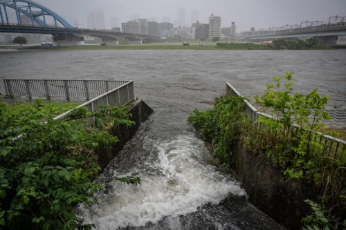 Typhoon slams into Japan triggering flood warnings and travel chaos