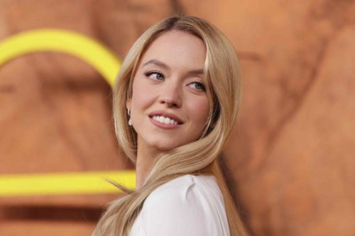 Sydney Sweeney's all-white high-low dress has an unexpected coquette detail and a divisive cape