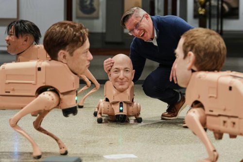 Robot dogs with Musk and Zuckerberg heads roam gallery for new exhibit