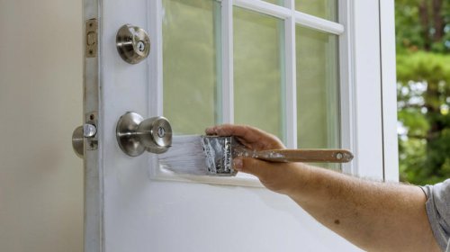 The sophisticated front door color that's taking over exterior home design trends